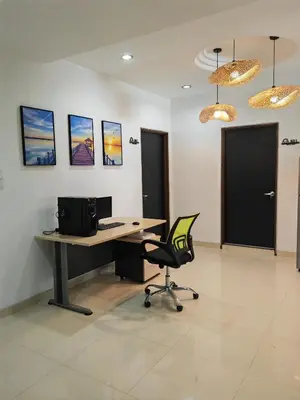 an office with a desk and a chair in a room at Padang Serai Cozy Roomstay Share Bathroom in Padang Serai