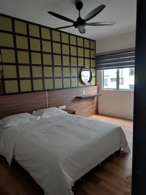 a bedroom with a bed and a ceiling fan at Adik aisyah muji pistachio homestay cameron highlands in Tanah Rata