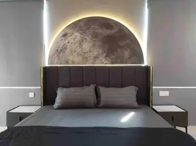 a bedroom with a bed with a moon mural on the wall at Dawn de Ville-Private Pool BBQ Karaoke 34-40pax in Ipoh