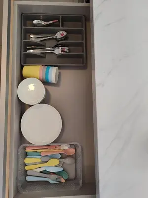 a drawer filled with utensils in a refrigerator at Invincible Seaview Vacation Condo 3R3B 8Pax in Bayan Lepas