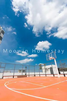 a basketball hoop with a blue sky and clouds at Modern Comfy Suite Room-9Pax in Perai