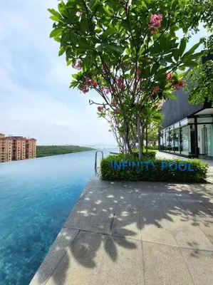 a tree in the middle of a swimming pool at Urban Muji Retreat Suites #3BR #2carparks in Jelutong