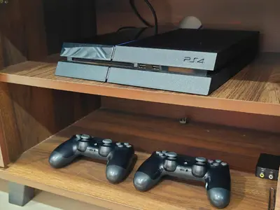 two video game controllers and a box on a table at 6-7Pax 3BR Waterpark Condo W Ps4 Near Ipoh Town in Kampong Pinji