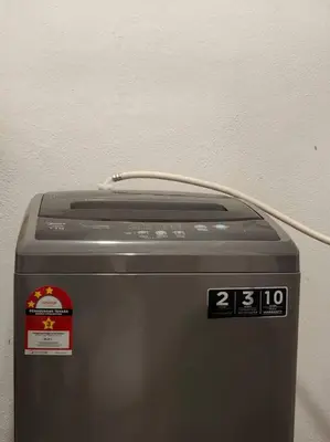 a machine with a cord on top of it at 6-7Pax 3BR Waterpark Condo W Ps4 Near Ipoh Town in Kampong Pinji