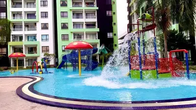 a pool with a water park with a water slide at 6-7Pax 3BR Waterpark Condo W Ps4 Near Ipoh Town in Kampong Pinji