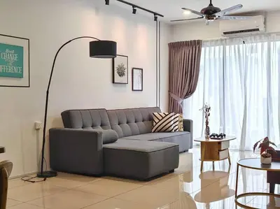 a living room with a couch and a table at 6-7Pax 3BR Waterpark Condo W Ps4 Near Ipoh Town in Kampong Pinji