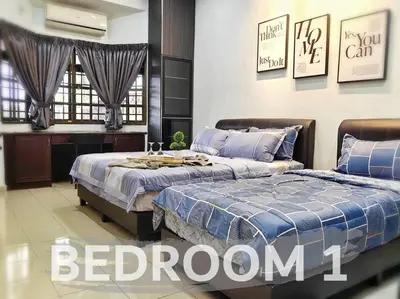 a bedroom with two beds and a desk at 【Ipoh Garden】4Br/8pax All Attractions w/in 15mins in Ipoh