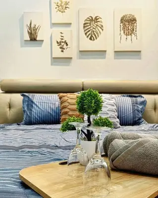 a table with two wine glasses on a bed at 【Ipoh Garden】4Br/8pax All Attractions w/in 15mins in Ipoh