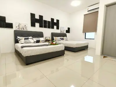 a living room with two beds and a couch at 15-19Pax SemiD Near Highwy W/Pool Table&Karaoke in Ipoh