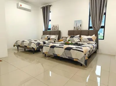 two beds sitting in a room with at 15-19Pax SemiD Near Highwy W/Pool Table&Karaoke in Ipoh