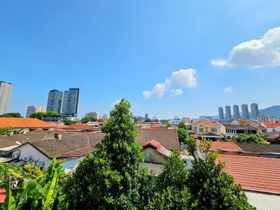 a view of a city with buildings and a tree at PANCHOR 6 HOSTEL in George Town