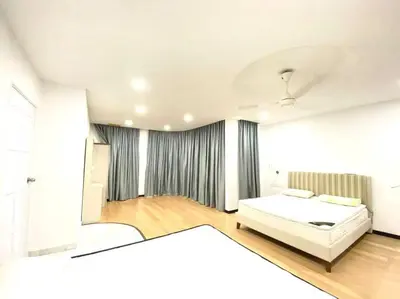 a white bedroom with a bed and a large window at Garden view bangalow wedding 12pax in Butterworth