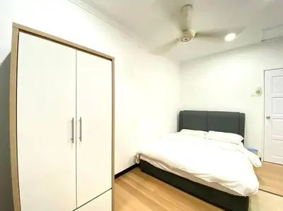 a bedroom with a bed and a large mirror at Garden view bangalow wedding 12pax in Butterworth