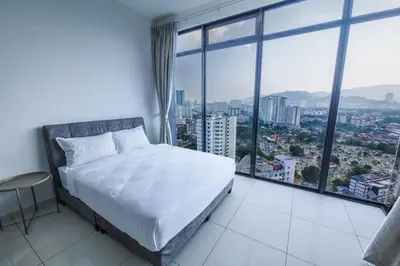 a bedroom with a white bed and a large window at Beacon Suites #Georgetown #RoofTopPool #23 #2Bedrooms in George Town