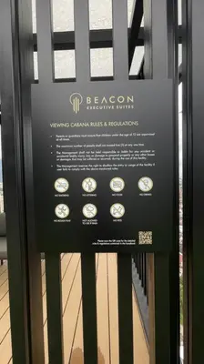 a sign on a glass door of a room with clocks at Beacon Suites #Georgetown #RoofTopPool #23 #2Bedrooms in George Town