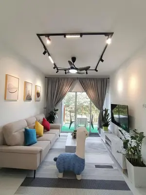 a living room with a couch and a dog on the floor at Dream 5 @ Emerald avenue in Brinchang