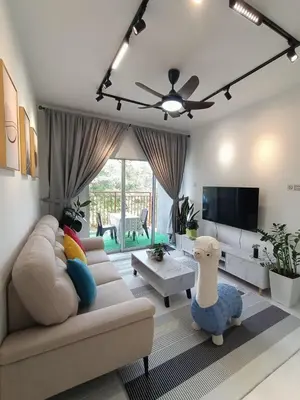 a living room with a couch and a tv at Dream 5 @ Emerald avenue in Brinchang