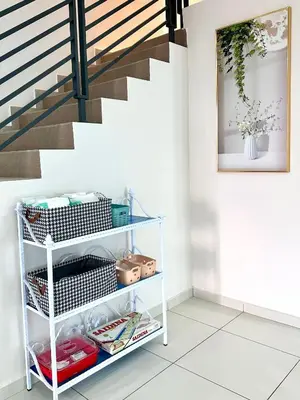 a staircase with a white shelf under a stair case at Peak Homestay@Ipoh Perak Malaysia 10-14Pax 5R/6B in Lahat