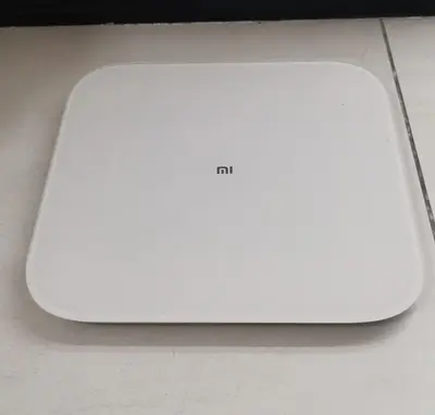 a white laptop computer sitting on top of a table at Urban Suites - Dolphin's Home in Jelutong