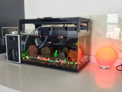 a fish tank sitting on top of a table at Urban Suites - Dolphin's Home in Jelutong