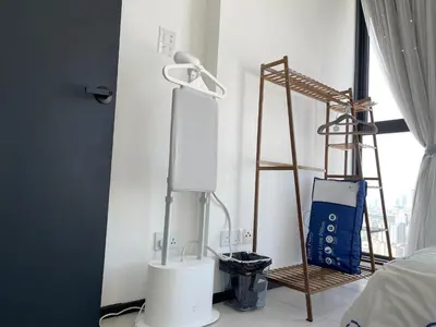 a room with a lamp and a ladder at Urban Suites - Dolphin's Home in Jelutong