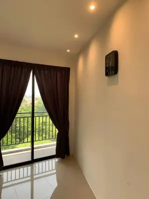 a room with a window with a view of a balcony at Modern Lux Suite, The Cove Hillside Residence in Ipoh