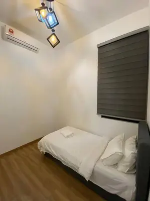 a bedroom with a white bed with a window at Modern Lux Suite, The Cove Hillside Residence in Ipoh