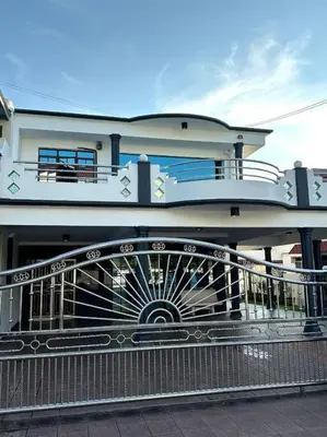 a building with a balcony with a fence at Cozy 2StoreyHome 5Room11Pax@ChaiLengPark in Perai