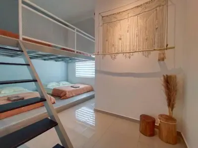 a room with two bunk beds and a ladder at Evening/Night de Ville-50pax Private Pool BBQ in Ipoh