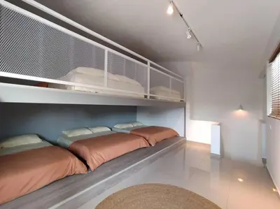 a bedroom with two beds on a shelf at Evening/Night de Ville-50pax Private Pool BBQ in Ipoh