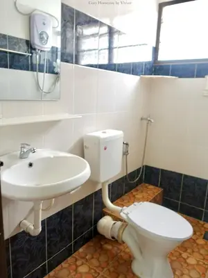 a bathroom with a toilet and a sink at Ipoh Cozy Homestay for 10-13pax in Ipoh