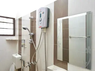 a bathroom with a shower with a phone on the wall at Ipoh Cozy Homestay for 10-13pax in Ipoh