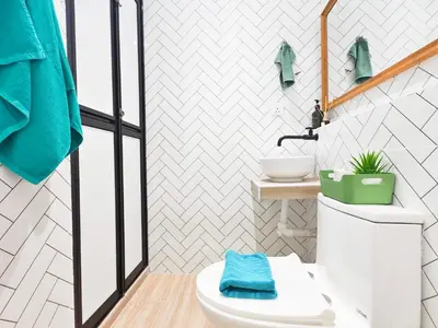 a bathroom with a toilet and a sink at 35 BeachHouse Batu Ferringhi 7 Bedroom 7 Bathroom EV friendly in Batu Ferringhi