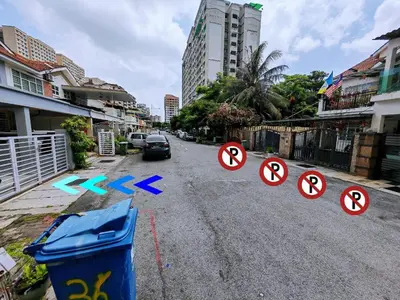 a street with signs on the side of the road at 38 Georgetown 3 Storey Terrace local food 5rooms 16pax in George Town