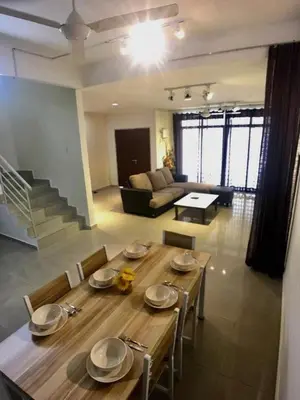 a living room with a wooden table and a couch at 38 Georgetown 3 Storey Terrace local food 5rooms 16pax in George Town