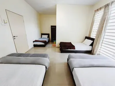 a room with two beds and a couch at 38 Georgetown 3 Storey Terrace local food 5rooms 16pax in George Town