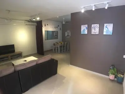 a living room with a couch and a wall at 38 Georgetown 3 Storey Terrace local food 5rooms 16pax in George Town