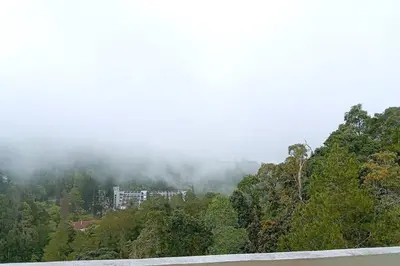 a building on the side of a hill with trees at Silverpart Resort Fraser Hill C3-6-2 Forest View High Floor No lift in Bukit Fraser