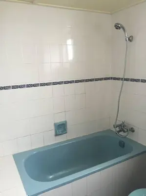 a blue bath tub in a bathroom with a shower at Silverpart Resort Fraser Hill C3-6-1 Forest View High Floor No lift in Bukit Fraser