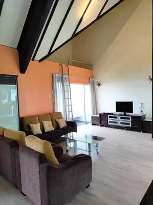 a living room with two couches and a tv at Silverpart Resort Fraser Hill C3-6-1 Forest View High Floor No lift in Bukit Fraser
