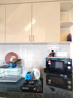 a kitchen with a microwave and a counter top at Silverpart Resort Fraser Hill C3-6-1 Forest View High Floor No lift in Bukit Fraser