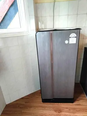 a metal refrigerator in a room with a window at Silverpart Resort Fraser Hill C3-6-1 Forest View High Floor No lift in Bukit Fraser