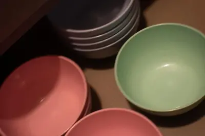 three bowls and plates sitting on a table at Prime Comfort Seaview with Netflix and Water Filter near Georgetown in Jelutong