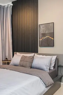 a bedroom with a large bed with white pillows at Serene Modern Family Retreat(2-7 pax)&Sunrise View in Cameron Highlands