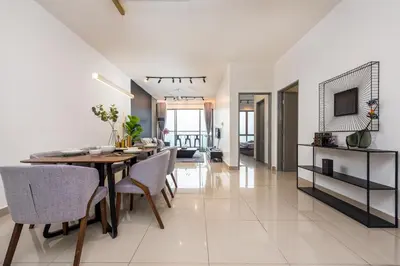 a dining room and living room with a table and chairs at Serene Modern Family Retreat(2-7 pax)&Sunrise View in Cameron Highlands
