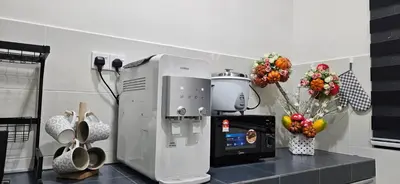 a kitchen with a coffee maker on a counter at TELUK INTAN LANDED LUXURY HOMESTAY 3BEDROOM in Teluk Intan