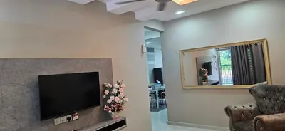 a living room with a television and a mirror at TELUK INTAN LANDED LUXURY HOMESTAY 3BEDROOM in Teluk Intan