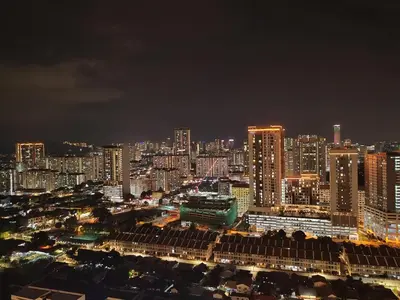 a city lit up at night with tall buildings at Cityscape Suite, 4 to 5 Pax at Urban Suites Georgetown by SuperStay in Jelutong
