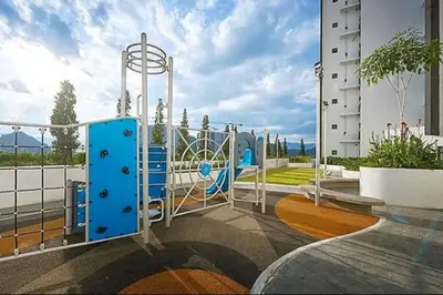 a playground in front of a building at Cozy Homestay \u6e29\u99a8\u6c11\u5bbf @The Horizon Ipoh\u516c\u5bd3\u65e0\u8fb9\u6cf3\u6c60 (6-10\u4eba\uff09 in Ipoh