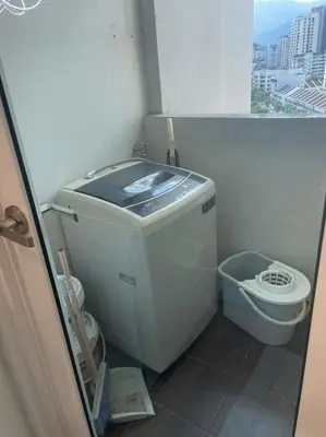 a small bathroom with a toilet and a window at Georgetown ins cozy 2 bedroom in George Town